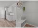 White bench with storage in a hallway at 2808 Raddercrest Ct, Fuquay Varina, NC 27526