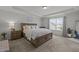 Spacious main bedroom with large windows, plush carpeting, and a dresser at 2808 Raddercrest Ct, Fuquay Varina, NC 27526