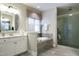 Elegant bathroom with soaking tub and walk-in shower at 3142 Armeria Dr, Apex, NC 27502