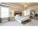 Spacious primary bedroom with large windows and en-suite bathroom at 3142 Armeria Dr, Apex, NC 27502