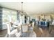 Open concept dining area with round table and seating for six at 3142 Armeria Dr, Apex, NC 27502