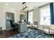 Spacious home office with built-in shelving and large windows at 3142 Armeria Dr, Apex, NC 27502