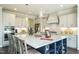 Modern kitchen with large island, stainless steel appliances, and ample counter space at 3142 Armeria Dr, Apex, NC 27502