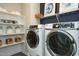 Laundry room with washer, dryer, and ample storage at 3142 Armeria Dr, Apex, NC 27502