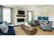 Relaxing living room with fireplace and ample natural light at 3142 Armeria Dr, Apex, NC 27502
