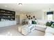 Versatile loft area features a sectional sofa and wet bar at 3142 Armeria Dr, Apex, NC 27502