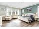 Relaxing main bedroom with ample natural light and sitting area at 328 Golf Vista Trl, Holly Springs, NC 27540