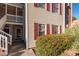 Townhouse exterior with red shutters and landscaping at 3369 Tarleton E # E03, Durham, NC 27713