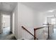 Upstairs hallway with carpet and access to bedrooms at 3406 Sir Colleton Ct, Raleigh, NC 27612