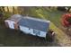 Aerial view of a well-maintained outbuilding with a modern roof, surrounded by lush greenery at 405 N Ninth St, Mebane, NC 27302