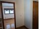 Hallway with a view of a window covered living room at 405 N Ninth St, Mebane, NC 27302