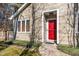 House exterior with red front door and landscaping at 4118 Pin Oak Dr, Durham, NC 27707