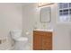 Modern bathroom with updated vanity, toilet, and gold fixtures at 4121 Pin Oak Rd, Raleigh, NC 27604