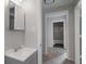 Clean bathroom with vanity, medicine cabinet, and tub at 423 Potter St, Durham, NC 27701