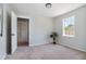 Bright bedroom with neutral walls, carpet, and ample closet space at 423 Potter St, Durham, NC 27701