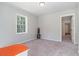 Bright bedroom with neutral walls and carpet at 423 Potter St, Durham, NC 27701