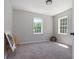 Spacious bedroom with two windows and neutral decor at 423 Potter St, Durham, NC 27701