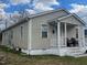 Beige house with front porch and small yard at 423 Potter St, Durham, NC 27701