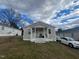 Tan house with white trim and porch, on a grassy lot at 423 Potter St, Durham, NC 27701