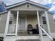 Cozy front porch with wicker chairs at 423 Potter St, Durham, NC 27701