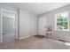 Living room with door to bedroom and neutral decor at 423 Potter St, Durham, NC 27701