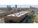 Aerial view of the back of a brick building showcasing its architecture and city surroundings at 500 N Duke St # 56-207, Durham, NC 27701