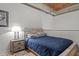 Comfortable bedroom with wood floors and a night stand at 500 N Duke St # 56-207, Durham, NC 27701