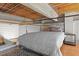Loft bedroom with wood ceilings and modern bed at 500 N Duke St # 56-207, Durham, NC 27701