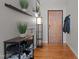 Bright entryway with wood floors and built-in shelving at 500 N Duke St # 56-207, Durham, NC 27701