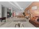 Common area living room with exposed brick wall at 500 N Duke St # 56-207, Durham, NC 27701