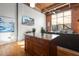 Open living area with exposed brick and hardwood floors at 500 N Duke St # 56-207, Durham, NC 27701