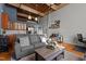 Open concept living area with hardwood floors and exposed beams at 500 N Duke St # 56-207, Durham, NC 27701