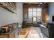 Spacious living room with hardwood floors and exposed brick wall at 500 N Duke St # 56-207, Durham, NC 27701
