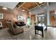 Spacious living room with exposed brick and high ceilings at 500 N Duke St # 56-207, Durham, NC 27701