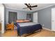 A comfortable bedroom featuring a ceiling fan and hardwood floors at 5141 Nc-39 N Hwy, Henderson, NC 27537