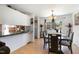 Dining area with a view of the back patio and a pass-through to the kitchen at 5141 Nc-39 N Hwy, Henderson, NC 27537