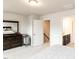 Spacious bedroom with a dresser and closet access, carpet flooring and neutral walls at 5238 Beardall St, Raleigh, NC 27616