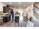 Modern kitchen features dark wood cabinetry, stainless steel appliances, and a spacious granite island at 5238 Beardall St, Raleigh, NC 27616
