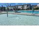 Bright community pool area with lounge chairs, water features, and clear blue water on a sunny day at 5238 Beardall St, Raleigh, NC 27616