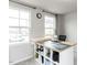 Bright room with sewing and cutting table and large window at 5238 Beardall St, Raleigh, NC 27616