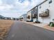 Modern townhome street view, featuring garages and balconies at 5238 Beardall St, Raleigh, NC 27616