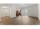 Bright dining area with wood floors and access to the kitchen and patio at 525 Whitworth Ln, Morrisville, NC 27560