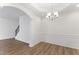 Bright dining room with hardwood floors and chandelier at 525 Whitworth Ln, Morrisville, NC 27560