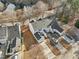 Aerial view of house and neighborhood, showcasing the property's location and surroundings at 5809 Neuse Wood Dr, Raleigh, NC 27616