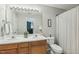 Double vanity bathroom with updated fixtures and shower at 5809 Neuse Wood Dr, Raleigh, NC 27616