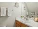 Clean bathroom with wood vanity and updated fixtures at 5809 Neuse Wood Dr, Raleigh, NC 27616