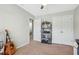 Bedroom with built-in shelving, closet, and guitar at 5809 Neuse Wood Dr, Raleigh, NC 27616