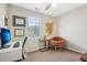 Home office with computer, comfy chair and window at 5809 Neuse Wood Dr, Raleigh, NC 27616