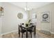Small dining area with square table and four chairs, near the kitchen at 5809 Neuse Wood Dr, Raleigh, NC 27616