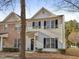 Charming two-story home with black shutters and a well-maintained lawn, perfect for families at 5809 Neuse Wood Dr, Raleigh, NC 27616